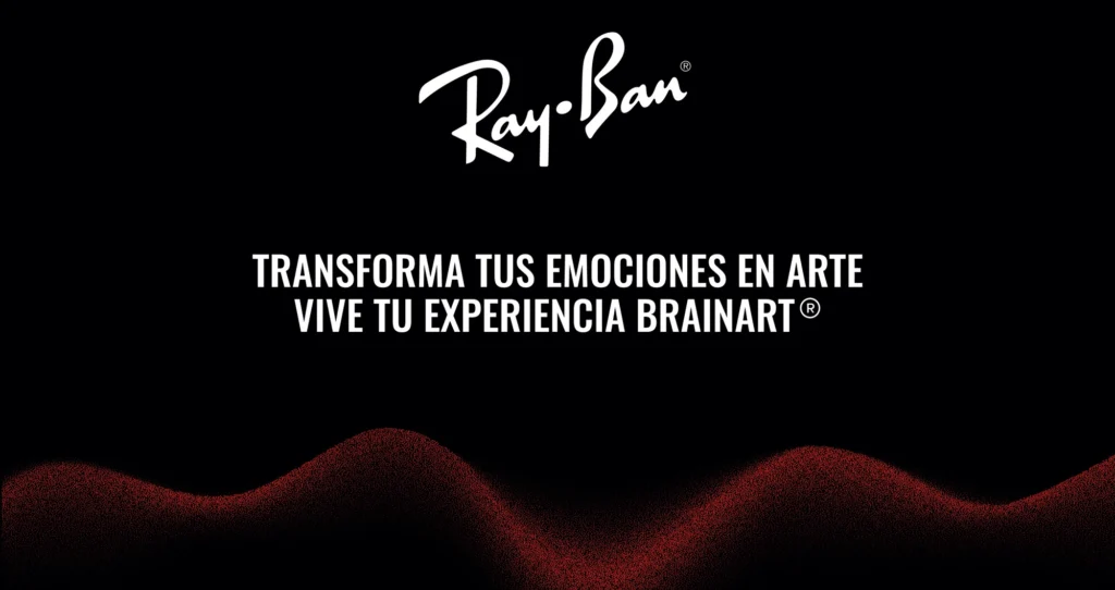 Grafica su fondo nero con il logo Ray-Ban in bianco in alto e la scritta in spagnolo "TRANSFORMA TUS EMOCIONES EN ARTE / VIVE TU EXPERIENCIA BRAINART®"; nella parte inferiore un'onda granulosa nei toni del rosso scuro attraversa l'immagine da un lato all'altro.